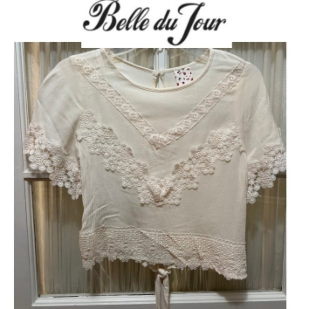 Belle du Jour top; cream color; lacy design on bodice and sleeves; girls' size L